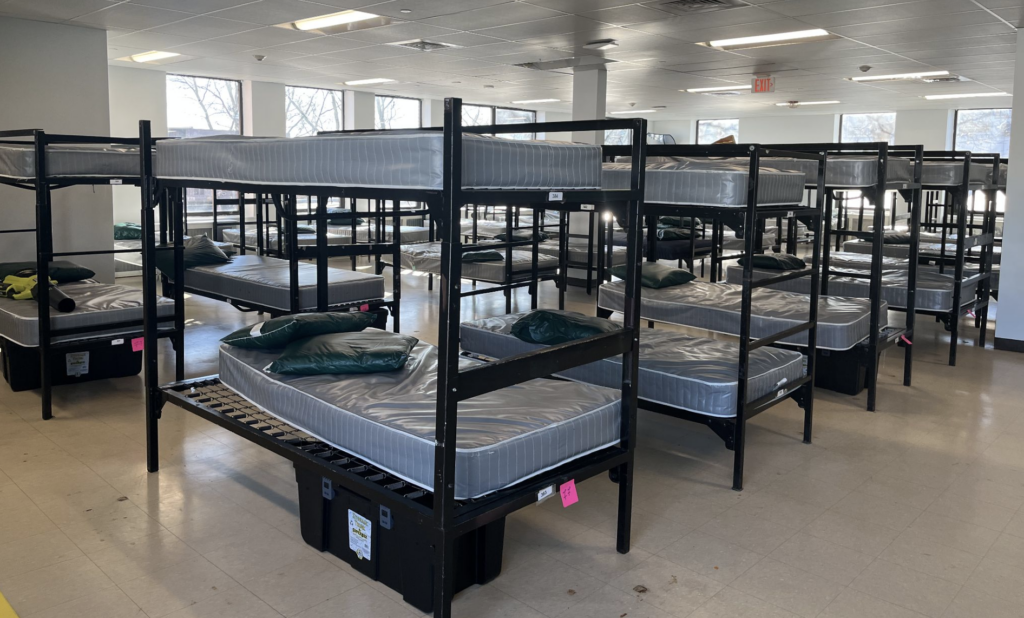 Neat room containing multiple bunk beds