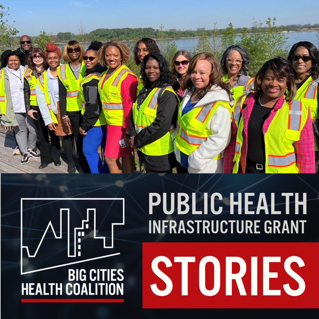 Shelby Co. health department director and employees wearing yellow vests standing outside