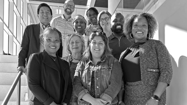 Ten of BCHC's board members standing on a staircase