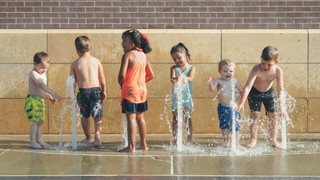 Kids playing in splash pad. Photo by Andrew Seaman for Unsplash